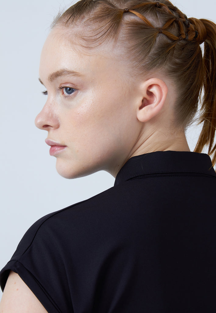 Mädchen & Damen und Gender Tennis Polo Shirt Loose-Fit, schwarz von SPORTKIND